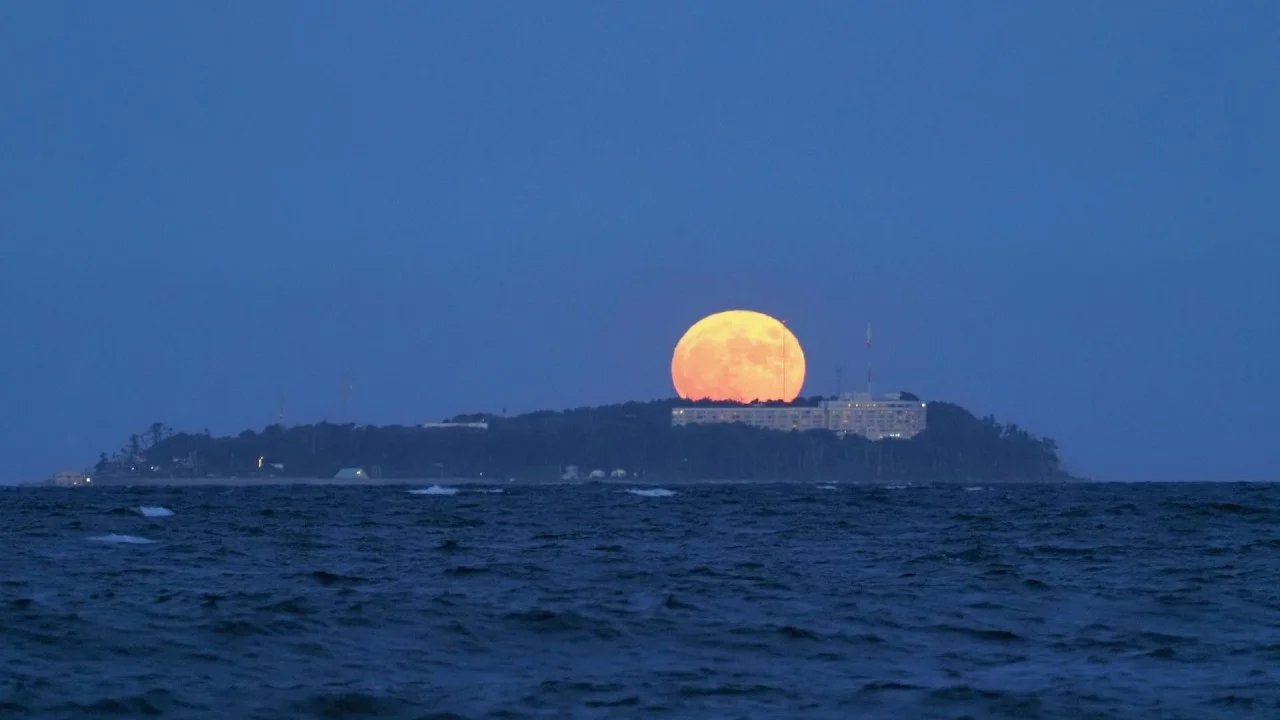 Harvest moon rising over Hatsushima Island, Japan